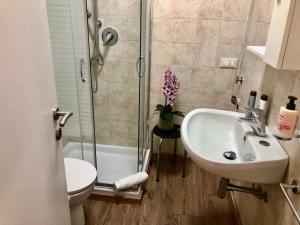 a bathroom with a shower and a sink and a toilet at Residence Villa Alba Room Nr 221 in Gardone Riviera +12 photos