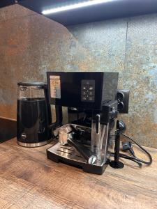 a coffee machine sitting on top of a counter at BoleslaviaApartments - Apartament Arte 2 - parking free, EV in Bolesławiec