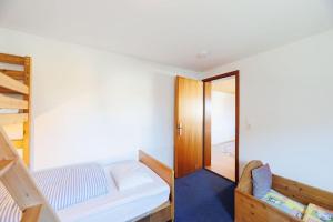 Кровать или кровати в номере Haugstetter Schwarzwaldhaus