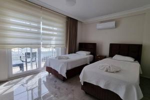 Postel nebo postele na pokoji v ubytování Dalyan Villa Hannibal