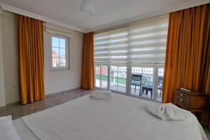 Postel nebo postele na pokoji v ubytování Dalyan Villa Hannibal