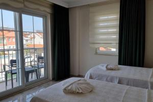 Postel nebo postele na pokoji v ubytování Dalyan Villa Hannibal
