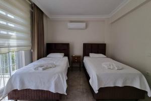 Postel nebo postele na pokoji v ubytování Dalyan Villa Hannibal