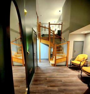 a hallway with a room with bunk beds and a mirror at Pinnacle Suites in Cowes