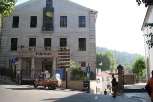 a small car parked in front of a building at Sintra1012 Boutique Guesthouse in Sintra