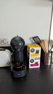 a coffee maker sitting on top of a counter at Le cosy botanique in Croix +15 photos