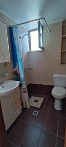 a bathroom with a toilet and a sink at North Bay Apartments in Rhodes Town +9 photos
