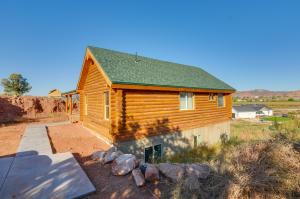 a log cabin with a pathway leading to it at The Cliffrose Cabin - Hike, Relax, Explore! in Kanab
