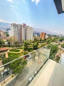 a view of a city from the balcony of a building at Hermoso Departamento completo en la mejor zona de Cochabamba in Cochabamba