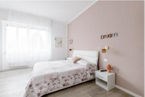 Postel nebo postele na pokoji v ubytování Casa di Kiki