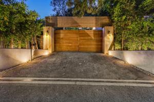 a wooden garage door in a driveway at Beverly Hillside Haven in Los Angeles