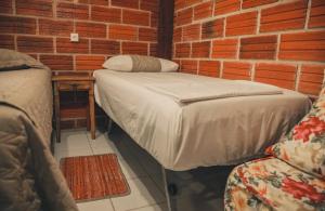 Postel nebo postele na pokoji v ubytování A Ilha Verde Hotel Pousada na Praia