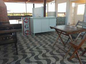 Η κουζίνα ή μικρή κουζίνα στο SeoMarujo Hostel rent a room Morro Branco +39 φωτογραφίες