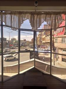 a large window with a view of a city at Hotel el LUCERO in Oruro