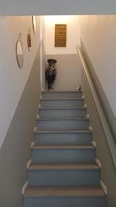 a stairway with a vase sitting on top of it at Cassiopée avec jardin in Fleury-les-Aubrais