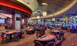 a casino with a lot of tables and chairs at Red Rock Casino Resort & Spa in Las Vegas