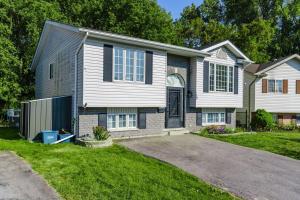 a large white house with a driveway at Fun & Cozy Retreat: Nature & Games in Trenton