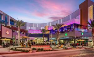 a shopping mall with palm trees in front of it at Dreamy Farmhouse in Studio City in Los Angeles