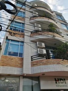 a tall building with a lot of windows at Hotel Canacabare Plaza in Yopal