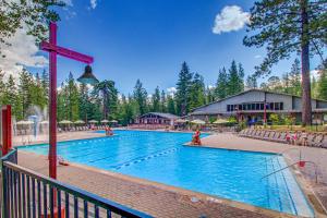 a large swimming pool with a red cross on top of it at View Condo at Northstar in Truckee