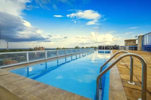 a swimming pool on the roof of a building at Valley Escapes Homes in Kiambu