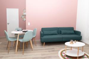 a living room with a couch and a table at LIKE CASA- Centre/Gare in Valence +18 photos