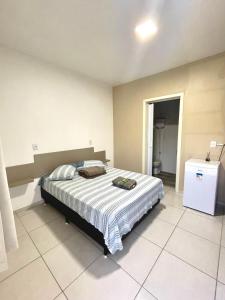 Postel nebo postele na pokoji v ubytování Residencial Hostel