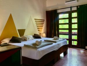 En eller flere senger på et rom på Hotel Villa Del Sol