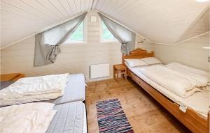 a bedroom with two beds and a couch in it at Awesome Home In yer With House A Mountain View in Øyer
