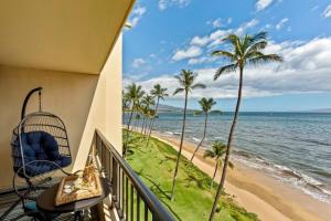 a balcony with a view of the ocean and a beach at Sugar Beach Resort 531- Direct oceanfront gem at Sugar Beach Resort in Kihei