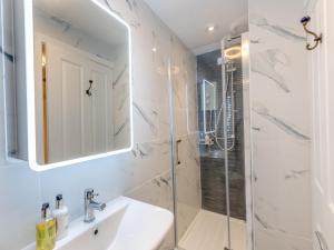 a bathroom with a sink and a shower at Wharf Annex in Coombe Hill