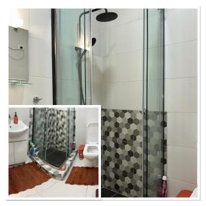 a bathroom with a shower and a toilet at SYN - Corniche in Brazzaville