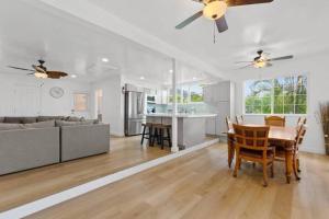 a kitchen and living room with a table and a couch at Shark's Cove Front, Sea View, Large 2BR, Full Kitchen, contact us for price drop in Haleiwa