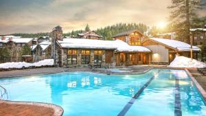 a house with a swimming pool in the snow at Hyatt Vacation Club at Northstar Lodge in Truckee