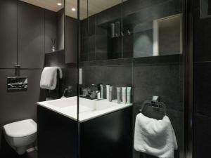 a bathroom with a sink and a toilet at Duplex 4 pers à Courchevel 1850 – Luxe et confort au pied des pistes - FR-1-631-175 in Courchevel