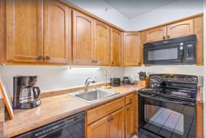 A kitchen or kitchenette at Royal Kahana 1009- Oceanfront unobstructed views from the 10th floor
