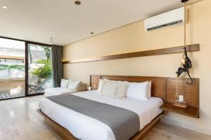 Postel nebo postele na pokoji v ubytování Faisano Boutique Hotel by Cruz Hoteles