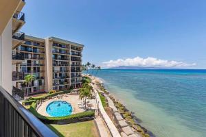 a view of the ocean from the balcony of a resort at Hololani A404- Ocean views from every room, 2 bedroom condo in Kahana