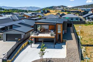 an aerial view of a house with roofs at Stylish Panoramic Mountain and Lake Views in Wanaka