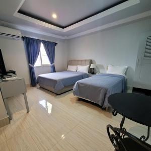 Postel nebo postele na pokoji v ubytování 한라호텔 Halla Hotel