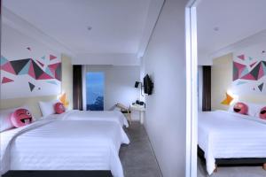 Voodi või voodid majutusasutuse favehotel Madiun toas