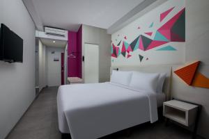 Voodi või voodid majutusasutuse favehotel Madiun toas