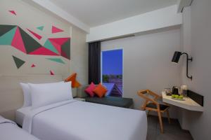 Voodi või voodid majutusasutuse favehotel Madiun toas