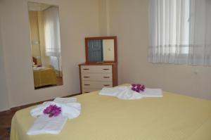 Postel nebo postele na pokoji v ubytování Dogan Apart Hotel + 14 fotografií