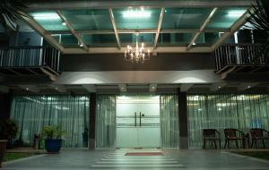 a large lobby with a chandelier in a building at Zaque's Hotel in Sungai Petani