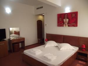 Postel nebo postele na pokoji v ubytování Hotel Flormang