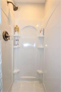 a white bathroom with a shower and a toilet at Secluded & Quiet Guest House-Cherry Valley-Morongo in Cherry Valley +58 photos
