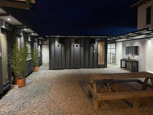 a room with a bench in the middle of a building at hosteline in Villa de Leyva