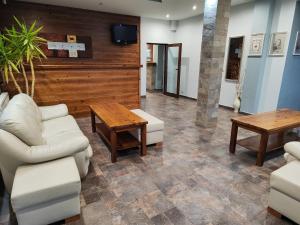 a living room with a couch and a table at Shekerdejiiski guest house bansko in Bansko