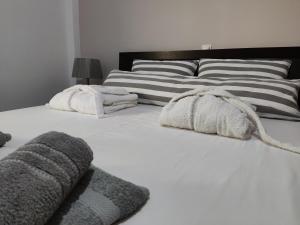 Postel nebo postele na pokoji v ubytování Mayla house